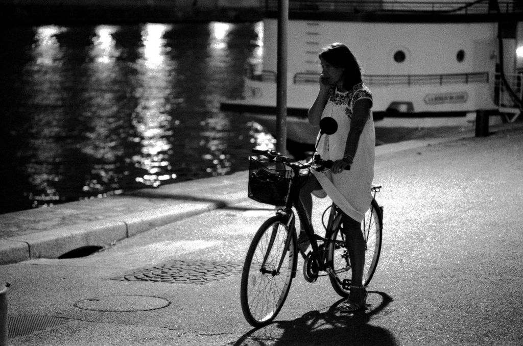 Girl with bicycle near the Seine