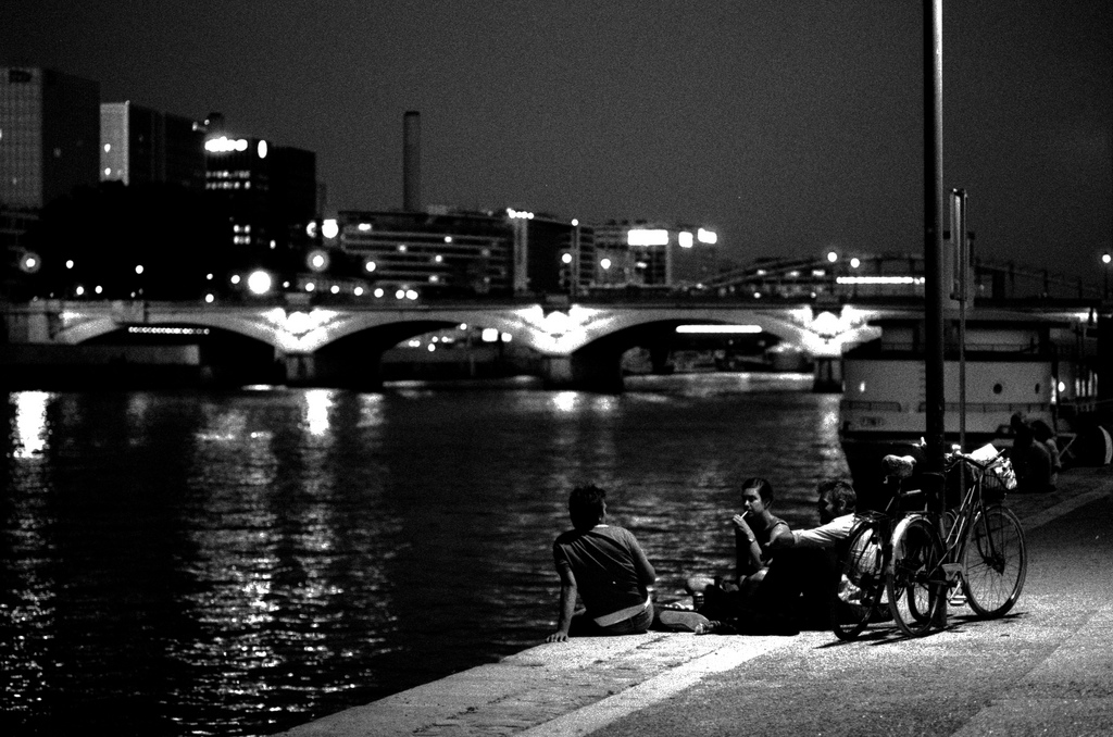 Sitting near the Seine at night